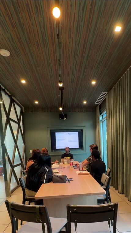 A study session beginning in a meeting room with the guide on screen