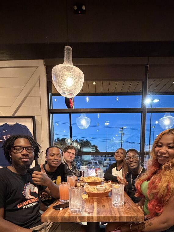 Club Polis members sharing a meal together